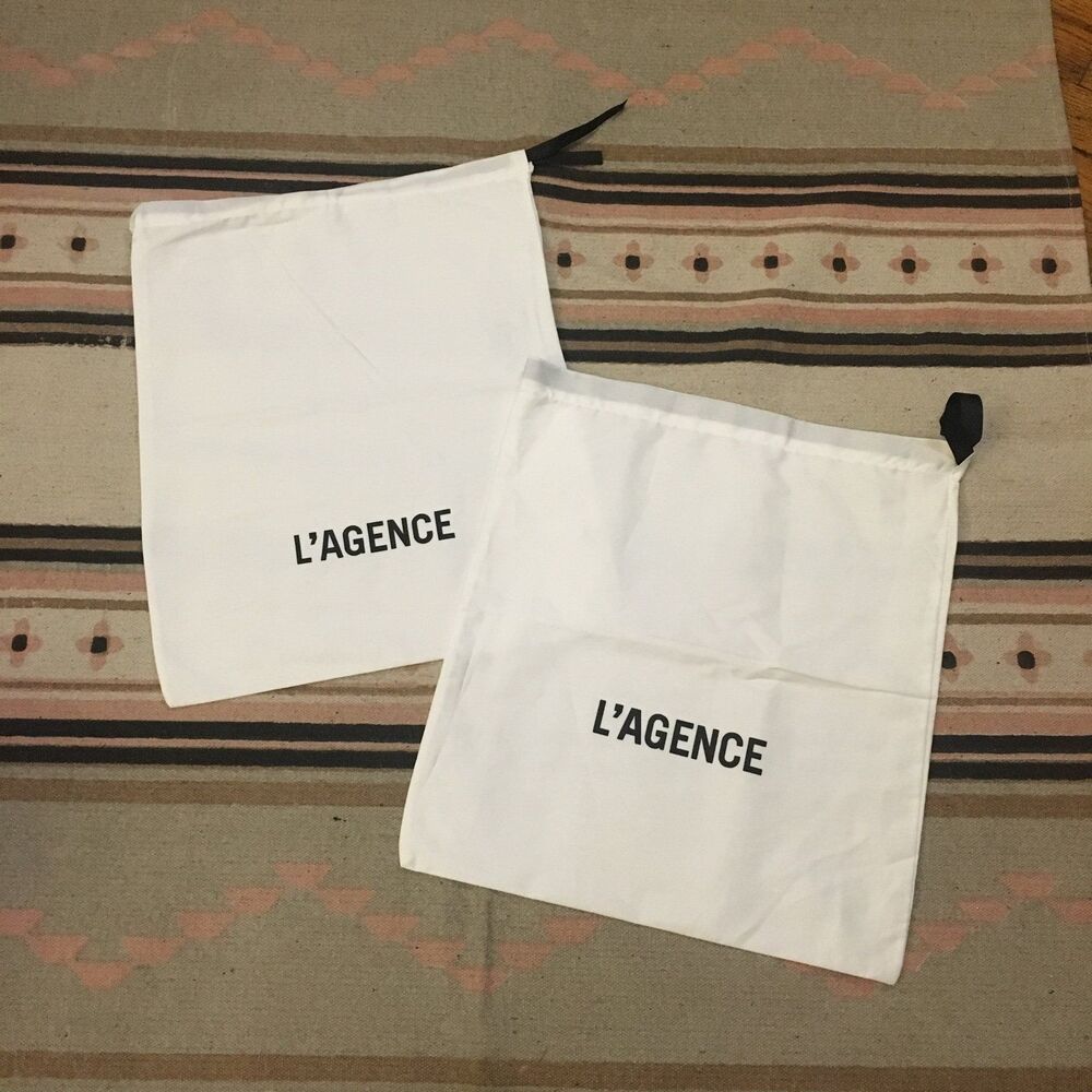 Two (2) L’Agence white w/ black lettering & drawstring Dustbag 15” x 12” new